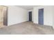 A large bedroom with gray carpeting and light gray trim with complementing doors at 2206 Loring Ct, Decatur, GA 30032