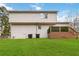 Exterior view of the home, showcasing the backyard, deck, and well-maintained landscaping at 2206 Loring Ct, Decatur, GA 30032