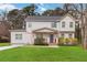 Charming two-story home with a well-manicured lawn, inviting porch, and a mix of painted brick and siding at 2206 Loring Ct, Decatur, GA 30032