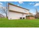 View of home exterior with green backyard and deck, with easy access to outdoor space at 2206 Loring Ct, Decatur, GA 30032