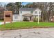 Two-story home with a manicured lawn, attractive curb appeal, and a modern address sign at 2206 Loring Ct, Decatur, GA 30032