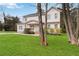 Two-story home framed by mature trees, featuring a well-kept lawn, an inviting porch, and a mix of painted brick and siding at 2206 Loring Ct, Decatur, GA 30032