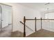 Hallway with wood banister and white railing leading to additional rooms at 2206 Loring Ct, Decatur, GA 30032