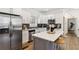 Modern kitchen features stainless steel appliances, white cabinets, and a center island with countertop seating at 2206 Loring Ct, Decatur, GA 30032