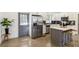 Updated kitchen with stainless steel appliances, center island, and ample counter space at 2206 Loring Ct, Decatur, GA 30032