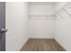 A walk-in closet with carpeted floor and metal shelves for organized storage at 2206 Loring Ct, Decatur, GA 30032