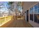 New wooden back deck overlooking a treeline and backyard with direct access to home's entry door at 3362 Alexis Ct, Marietta, GA 30066
