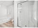 Bathroom featuring a glass-enclosed shower and soaking tub with coordinated white fixtures and tile at 3362 Alexis Ct, Marietta, GA 30066