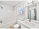 Bright bathroom featuring a tub, white vanity with marble countertop, and a window with natural light at 3362 Alexis Ct, Marietta, GA 30066