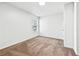 Neutral bedroom with tan carpet, a large window with blinds, and freshly painted walls at 3362 Alexis Ct, Marietta, GA 30066