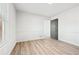 Bright bedroom featuring wood-look flooring, white walls and trim, and a window for plenty of natural light at 3362 Alexis Ct, Marietta, GA 30066