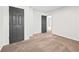 A secondary bedroom featuring neutral carpet, gray doors and hardware, and freshly painted walls at 3362 Alexis Ct, Marietta, GA 30066