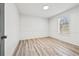 Bedroom with a large window providing natural light, complemented by fresh paint and vinyl wood-look flooring at 3362 Alexis Ct, Marietta, GA 30066