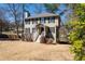 Charming two-story home with a traditional design, green shutters, and a well-manicured front lawn at 3362 Alexis Ct, Marietta, GA 30066