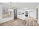 Bright kitchen with white cabinets, stainless steel appliances, granite countertops, and wood-look floors at 3362 Alexis Ct, Marietta, GA 30066