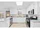 Beautiful kitchen featuring granite countertops, stainless steel appliances, and new vinyl wood-look floors at 3362 Alexis Ct, Marietta, GA 30066