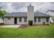Private backyard featuring mature landscaping and a charming patio area at 4096 Waldrop Hills Dr, Decatur, GA 30034