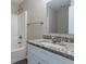 Bathroom vanity with granite countertop and a bathtub at 4096 Waldrop Hills Dr, Decatur, GA 30034