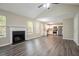 Stylish living room and kitchen combination featuring a fireplace, vaulted ceilings, and stainless steel appliances at 4096 Waldrop Hills Dr, Decatur, GA 30034