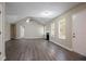 Spacious living room with a fireplace, vaulted ceilings, ceiling fan, and hardwood flooring throughout at 4096 Waldrop Hills Dr, Decatur, GA 30034