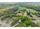 Aerial view of a residential area highlighting a home nestled among lush trees and a well-maintained landscape at 7031 Palomino Trl, Winston, GA 30187