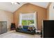 Spacious bedroom featuring neutral tones, a comfortable seating area, and a bright window view at 7031 Palomino Trl, Winston, GA 30187