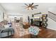 Spacious living room open to kitchen with hardwood floors and staircase to upper level at 7031 Palomino Trl, Winston, GA 30187