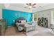 Spacious main bedroom featuring a trey ceiling, a bold accent wall, and large windows at 7031 Palomino Trl, Winston, GA 30187