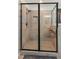 Close-up of tiled shower with glass enclosure, tiled walls, and shower head at 7031 Palomino Trl, Winston, GA 30187