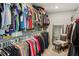 Walk-in closet with ample storage for clothes, bags, and accessories at 7031 Palomino Trl, Winston, GA 30187
