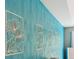 Close up of the teal wallpaper with flower cutout wall art at 7031 Palomino Trl, Winston, GA 30187