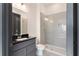 Modern bathroom features a glass-enclosed shower, sleek vanity, and contemporary fixtures, creating a luxurious and functional space at 750 Garden Reserve Ln, Alpharetta, GA 30005