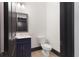 Stylish half-bathroom featuring a modern vanity, fixtures and minimalist design at 750 Garden Reserve Ln, Alpharetta, GA 30005