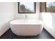 Elegant soaking tub provides a relaxing experience with a window view at 750 Garden Reserve Ln, Alpharetta, GA 30005