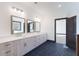 This bathroom boasts a long double sink vanity, modern lighting, and plenty of storage space at 750 Garden Reserve Ln, Alpharetta, GA 30005