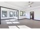 Bright bedroom with tray ceilings and large windows offering natural light and pleasant views at 750 Garden Reserve Ln, Alpharetta, GA 30005