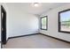 Bright bedroom with hardwood floors and two windows offering natural light and outdoor views at 750 Garden Reserve Ln, Alpharetta, GA 30005