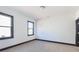 A bright bedroom with lots of natural light from two windows, neutral walls, and hardwood flooring at 750 Garden Reserve Ln, Alpharetta, GA 30005