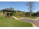 Picturesque community mailbox pavilion overlooking the neighborhood pond, with lush landscaping at 750 Garden Reserve Ln, Alpharetta, GA 30005