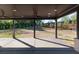 Outdoor patio with overhead lighting and ceiling fans, overlooking a backyard lawn at 750 Garden Reserve Ln, Alpharetta, GA 30005