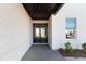 Front entrance featuring a double-door entry and white brick exterior at 750 Garden Reserve Ln, Alpharetta, GA 30005