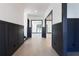 Inviting hallway with hardwood floors, and dark trim at 750 Garden Reserve Ln, Alpharetta, GA 30005