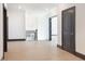 Bright hallway with hardwood flooring, neutral walls, and a view of the staircase at 750 Garden Reserve Ln, Alpharetta, GA 30005