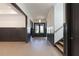 Hallway with wainscoting detail offering a view of the staircase and front door at 750 Garden Reserve Ln, Alpharetta, GA 30005
