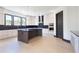 Modern kitchen featuring white cabinetry, dark countertops, and an island with seating at 750 Garden Reserve Ln, Alpharetta, GA 30005