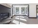 Bright and airy living room with a fireplace and natural light streaming through the windows at 750 Garden Reserve Ln, Alpharetta, GA 30005