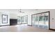 Bright living room boasts fireplace, many windows, and sliding glass doors to outdoor living at 750 Garden Reserve Ln, Alpharetta, GA 30005