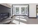 Bright living room with fireplace, dark trim, and lots of natural light at 750 Garden Reserve Ln, Alpharetta, GA 30005