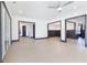 Open living room showing light-colored floors, open doors, and gray molding at 750 Garden Reserve Ln, Alpharetta, GA 30005