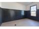 Versatile room featuring wainscoting detail and hardwood floors perfect for a home office, den, or playroom at 750 Garden Reserve Ln, Alpharetta, GA 30005